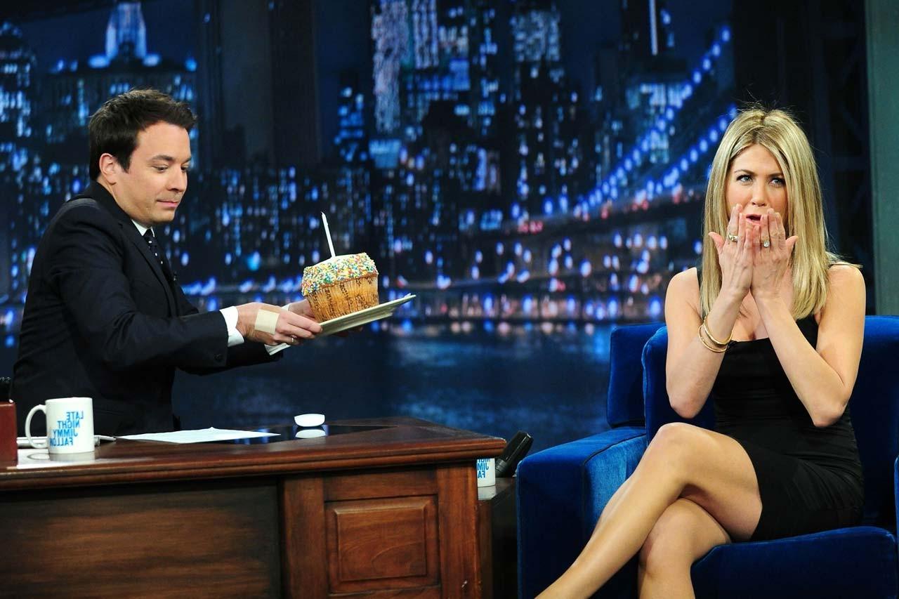 10P Jennifer Aniston showing her nice and great legs in black mini skirt paparazzi s