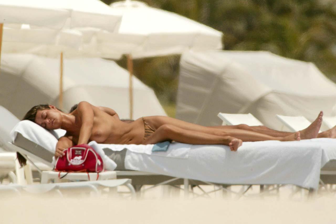 10P Manuela Arcuri exposing her nice big boobs on beach and ass in thong paparazzi p