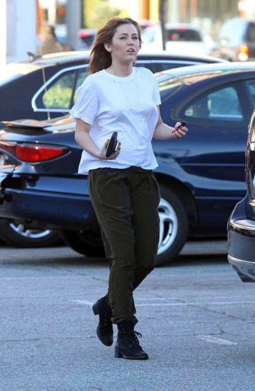 16P Miley Cyrus showing her sexy ass and hard nipples in see thru shirt