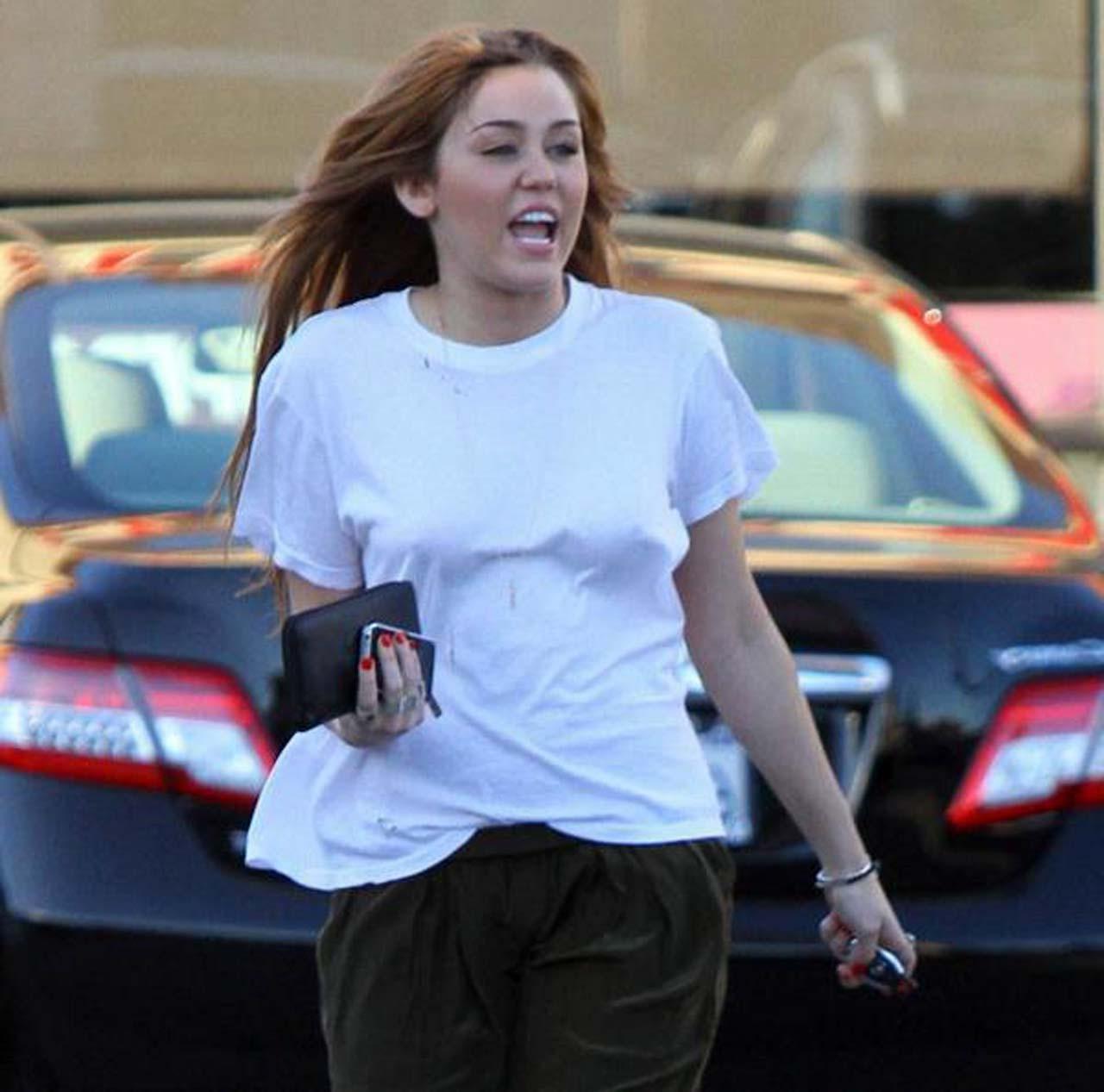 16P Miley Cyrus showing her sexy ass and hard nipples in see thru shirt