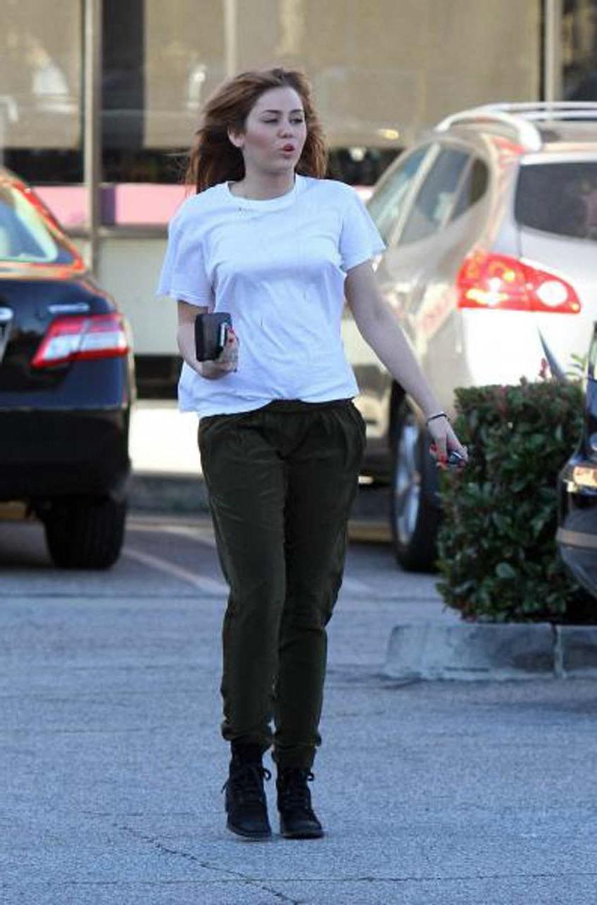 16P Miley Cyrus showing her sexy ass and hard nipples in see thru shirt
