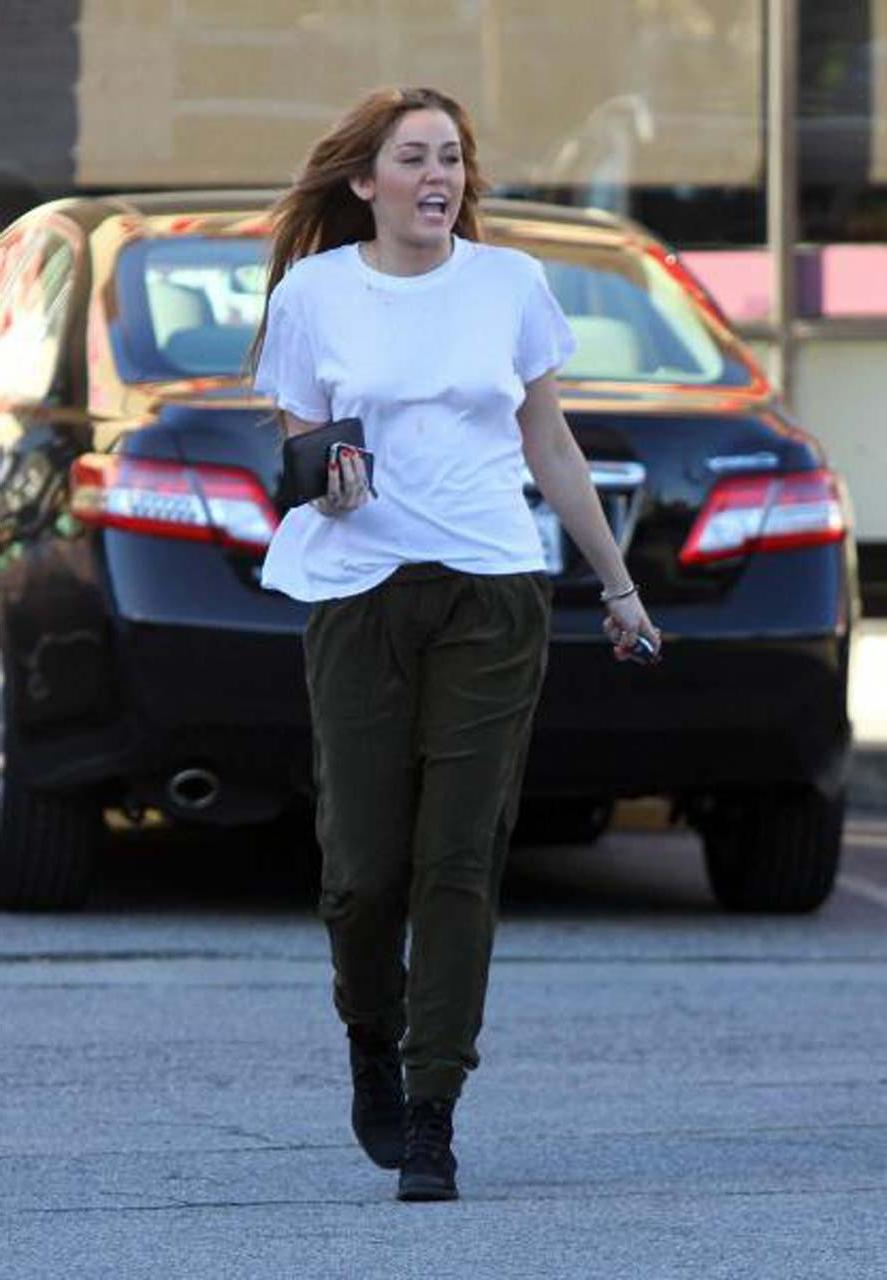 16P Miley Cyrus showing her sexy ass and hard nipples in see thru shirt