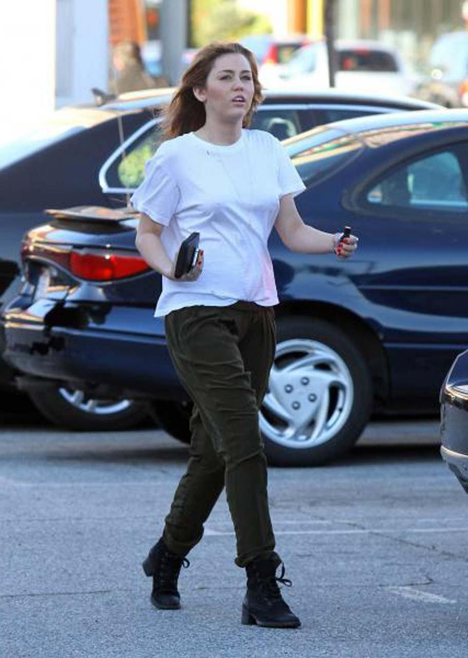 16P Miley Cyrus showing her sexy ass and hard nipples in see thru shirt