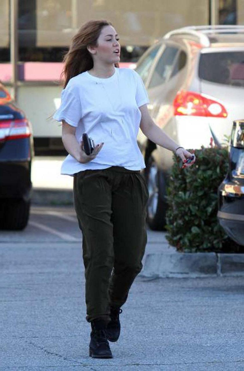 16P Miley Cyrus showing her sexy ass and hard nipples in see thru shirt