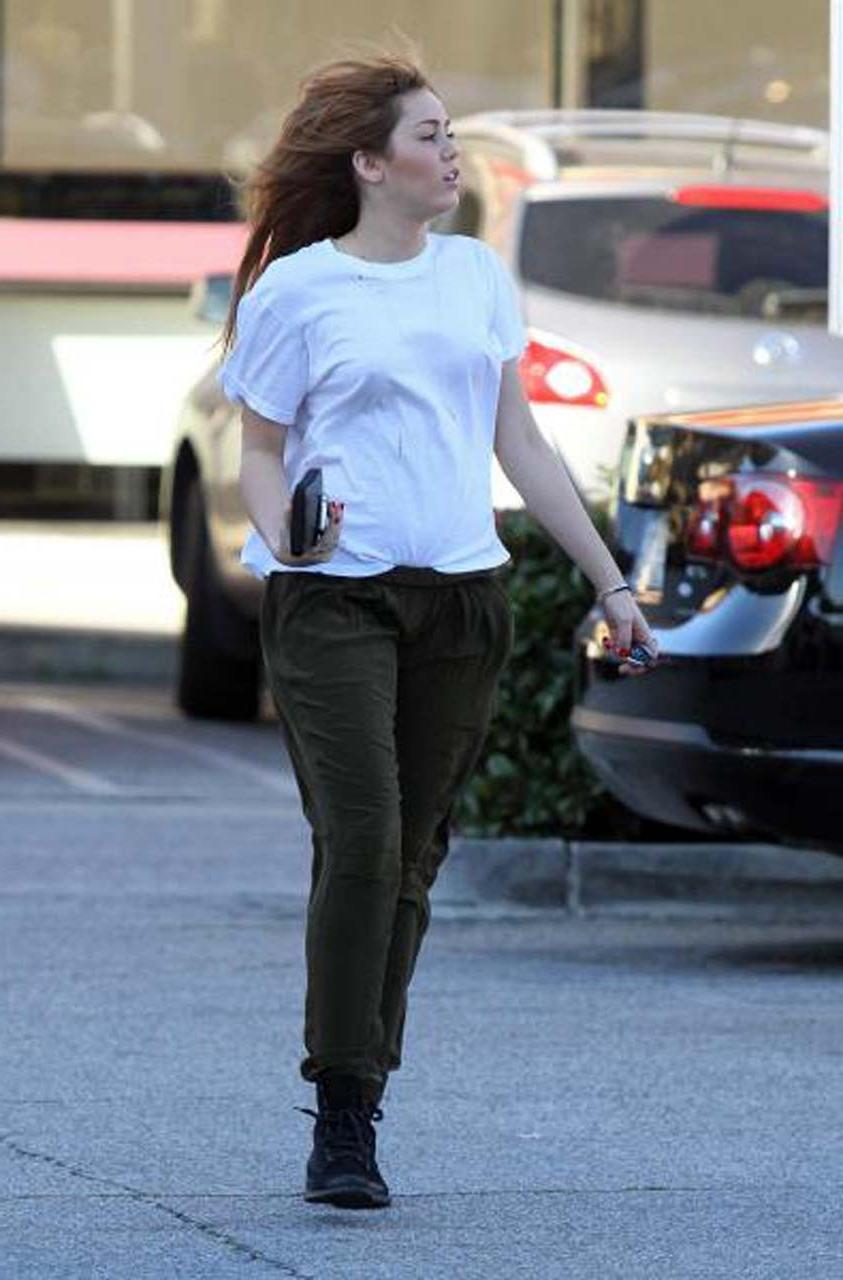 16P Miley Cyrus showing her sexy ass and hard nipples in see thru shirt