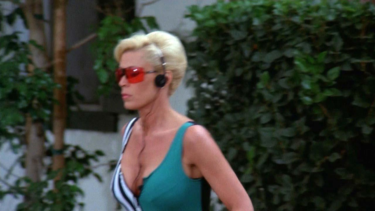 16P Leslie Easterbrook exposing her nice big boobs in wet see thru shirt