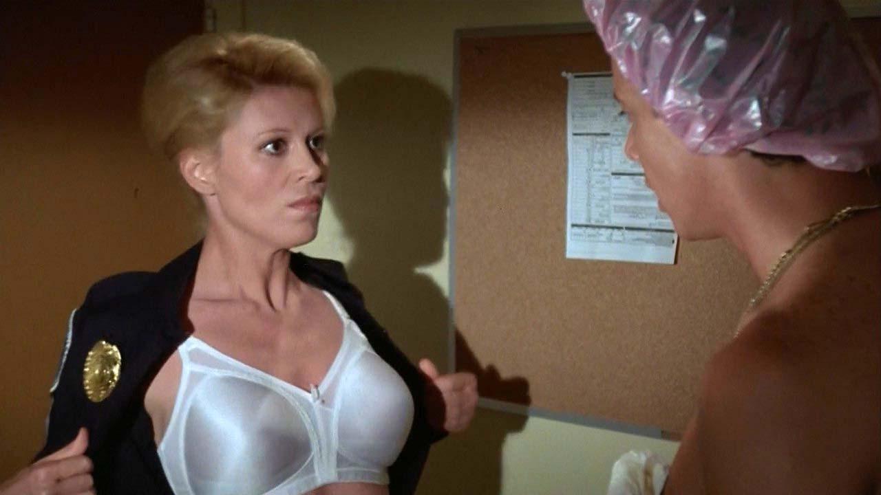 16P Leslie Easterbrook exposing her nice big boobs in wet see thru shirt