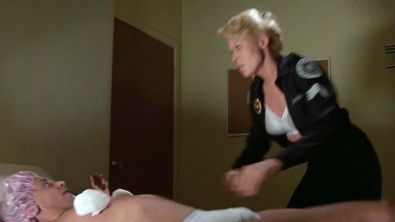 16P Leslie Easterbrook exposing her nice big boobs in wet see thru shirt