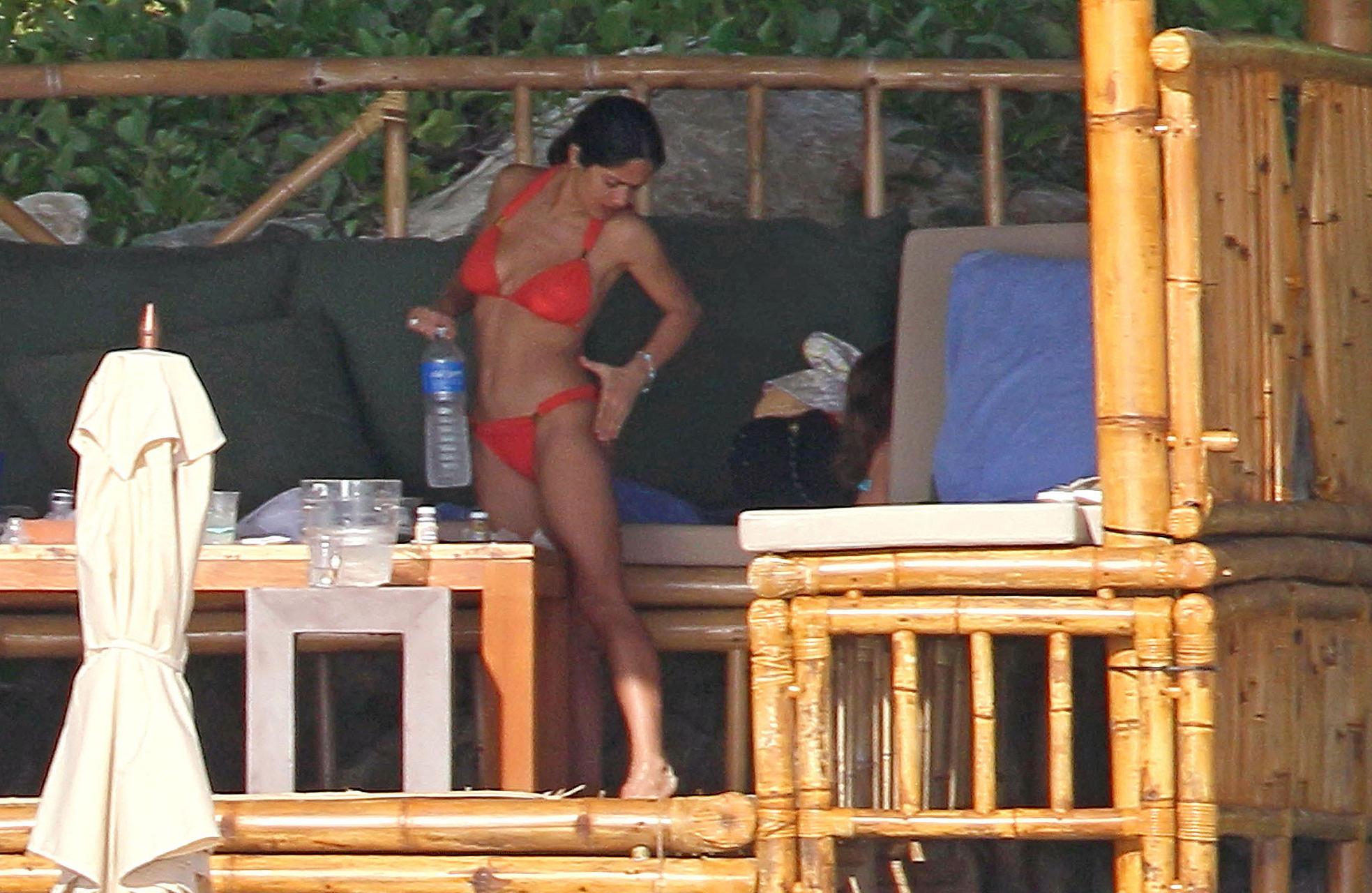 16P Salma Hayek exposing sexy body and huge boobs in red bikini on beach