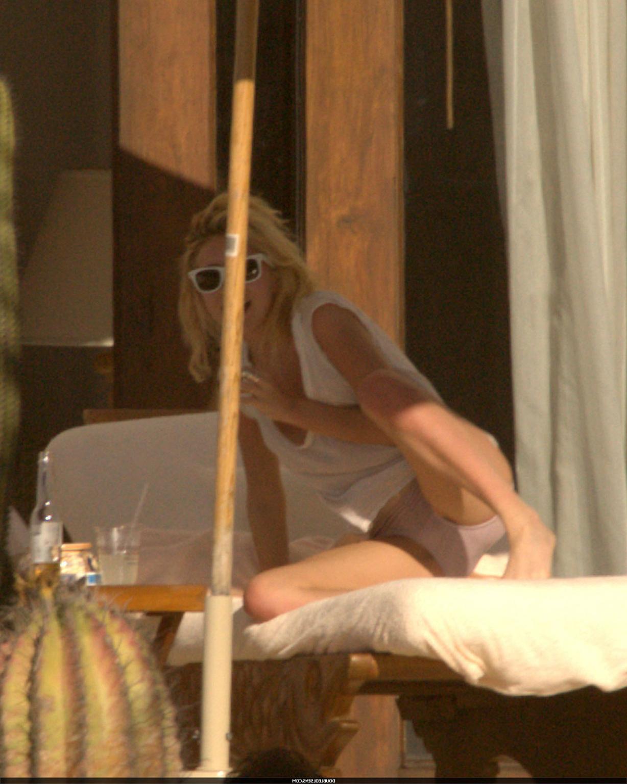 16P Ashley Olsen exposing her sexy body and nice tits in see thru shirt on pool