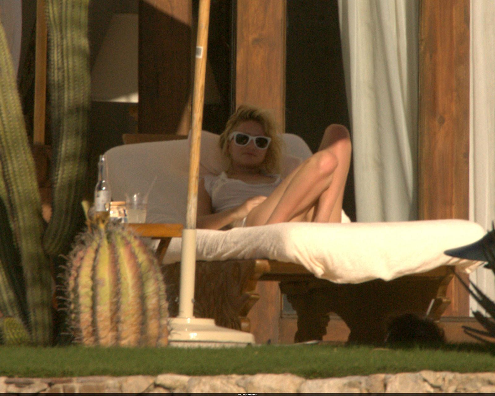 16P Ashley Olsen exposing her sexy body and nice tits in see thru shirt on pool