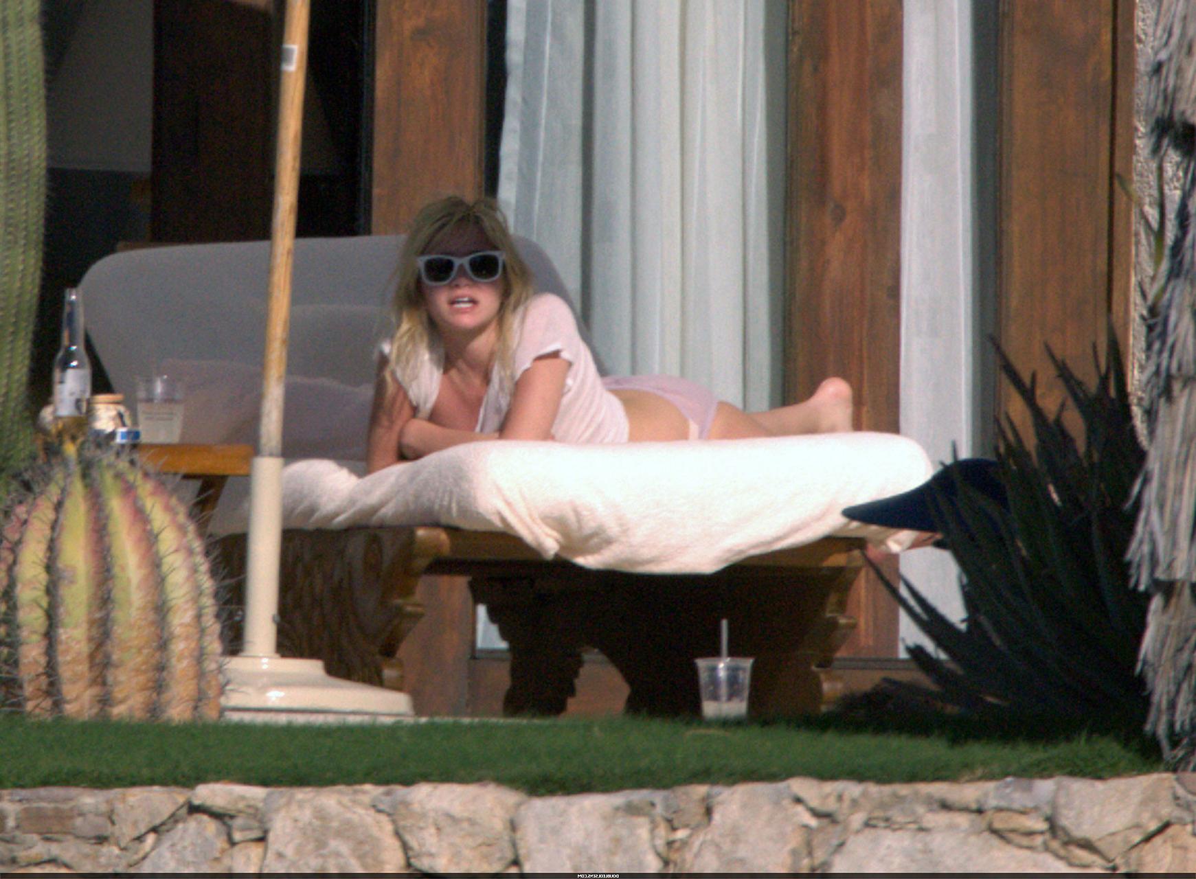 16P Ashley Olsen exposing her sexy body and nice tits in see thru shirt on pool