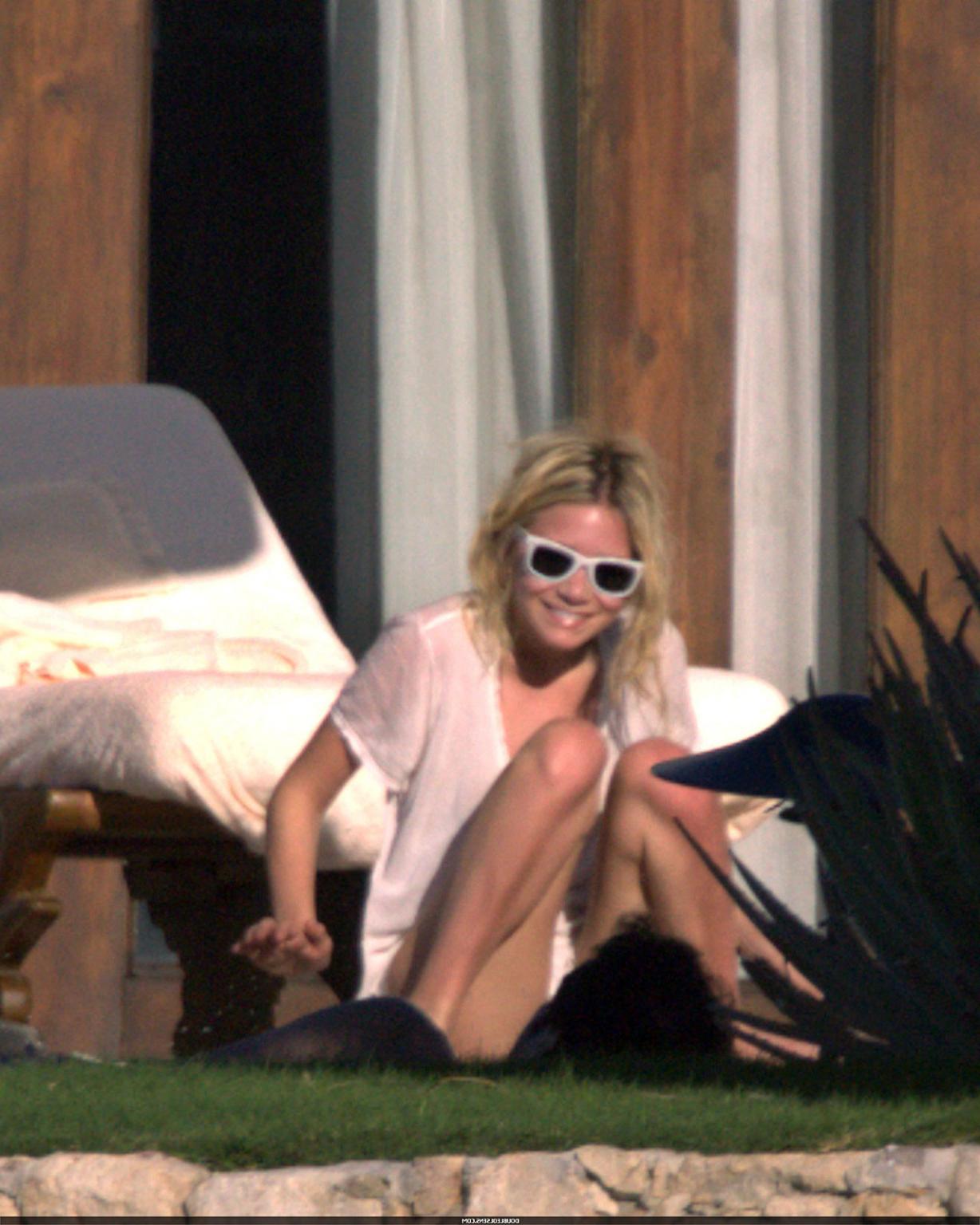 16P Ashley Olsen exposing her sexy body and nice tits in see thru shirt on pool