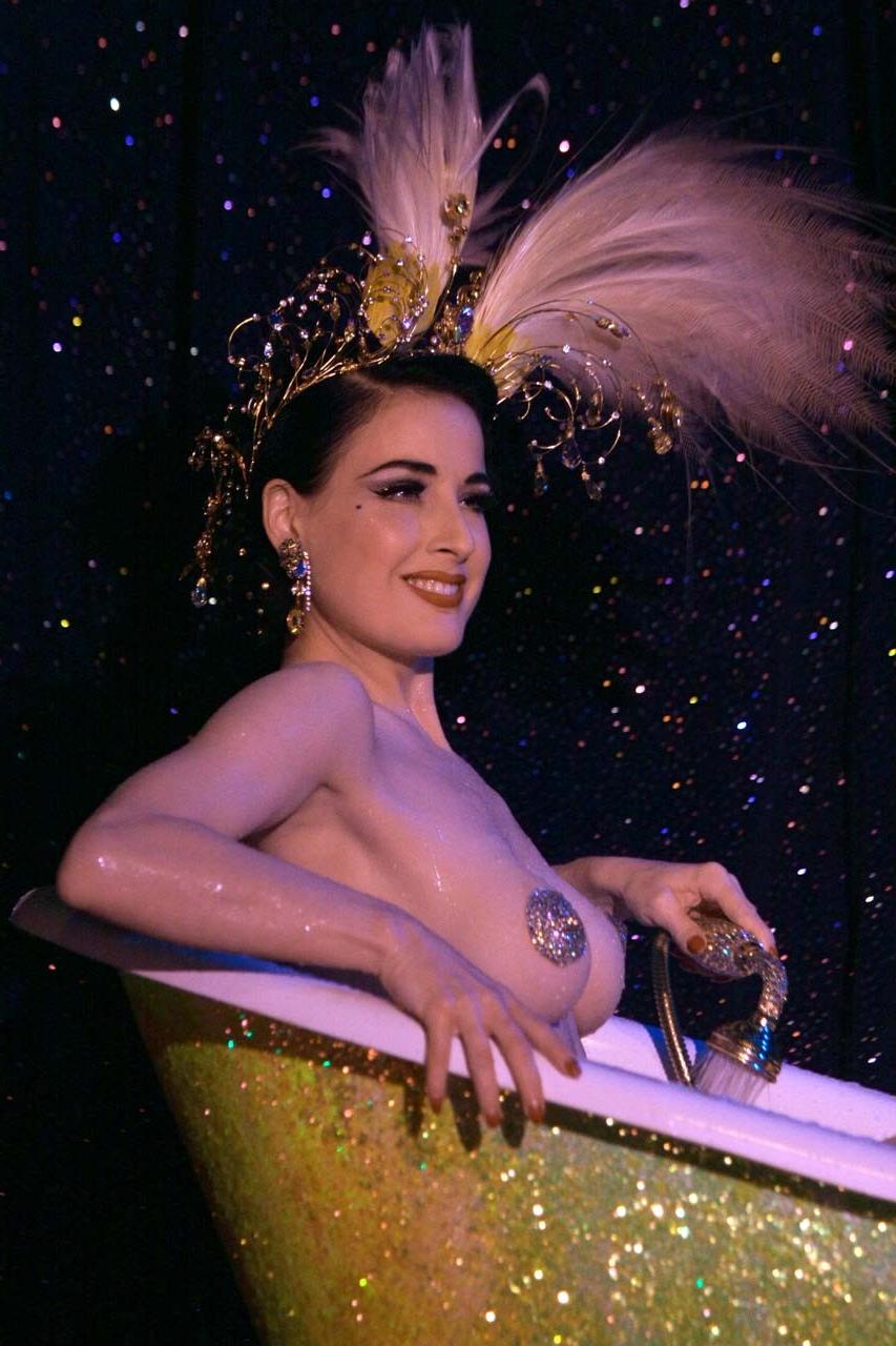 10P Dita Von Teese exposing her nice big breast on stage while performing