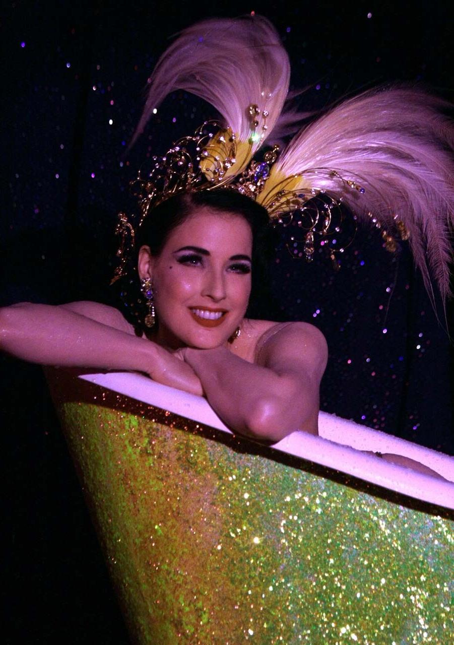 10P Dita Von Teese exposing her nice big breast on stage while performing