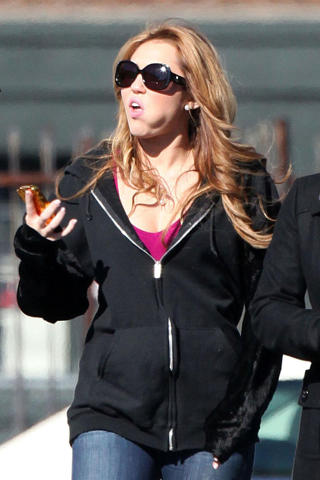 16P Miley Cyrus exposing her sexy legs on street and takeing drugs