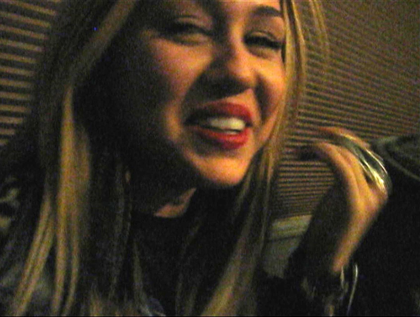 16P Miley Cyrus exposing her sexy legs on street and takeing drugs