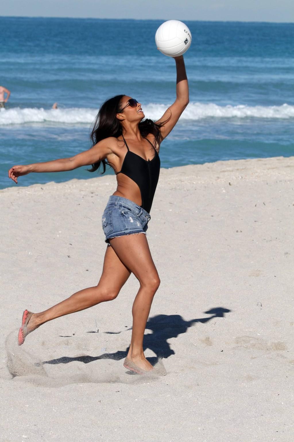 16P Alesha Dixon wearing sexy black swimsuit  denim shorts on the beach in Miami