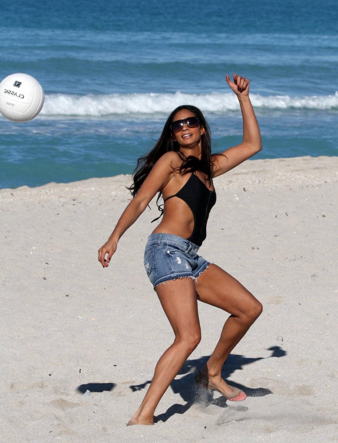 16P Alesha Dixon wearing sexy black swimsuit  denim shorts on the beach in Miami