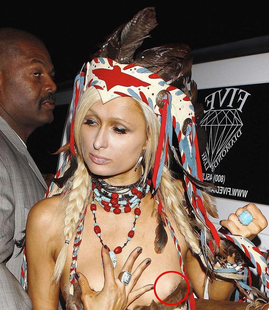 10P Paris Hilton looking very sexy in Helloween costume and showing her big cleavage