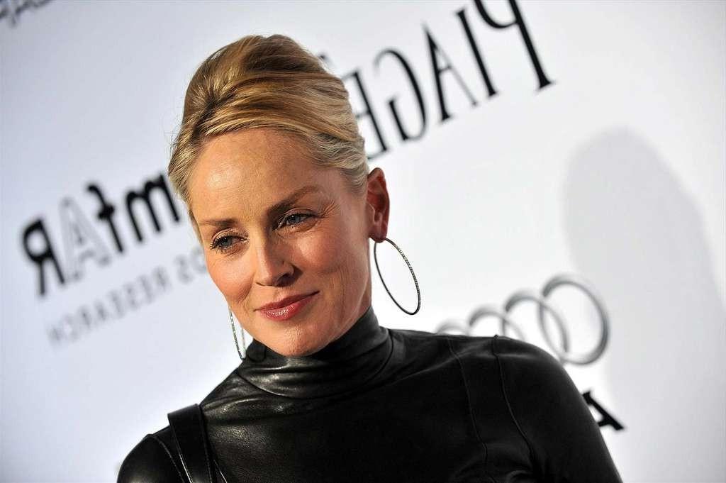10P Sharon Stone exposing her perky boobs and fucking hard with guy in nude movie sc
