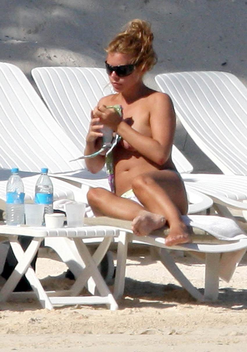 15P Billie Piper sunbathing topless on the beach