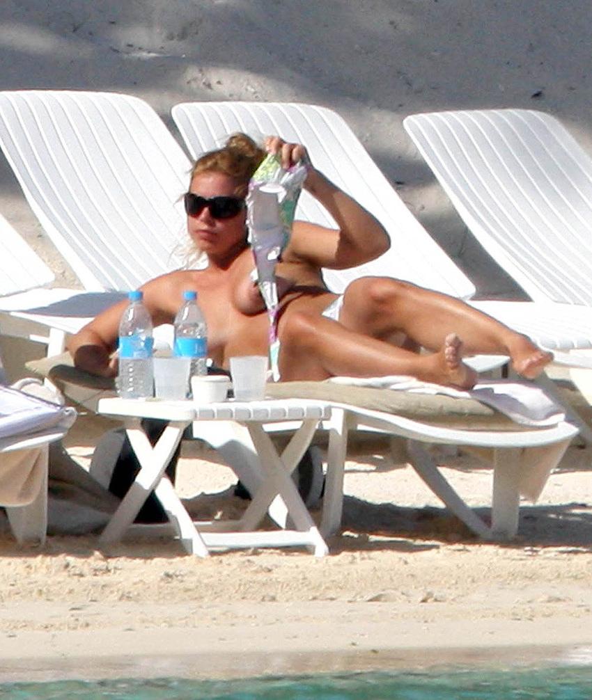 15P Billie Piper sunbathing topless on the beach
