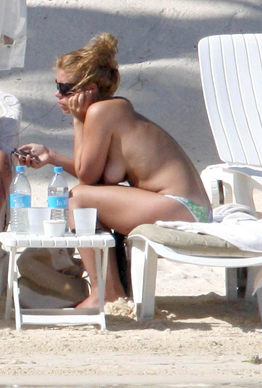 15P Billie Piper sunbathing topless on the beach