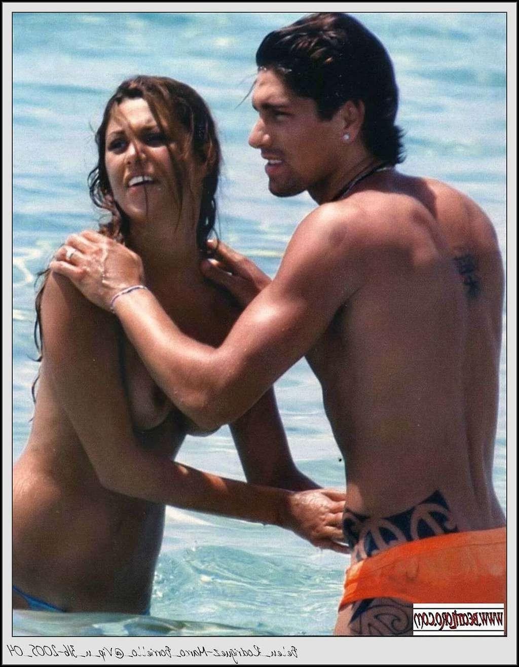10P Belen Rodriguez exposing her nice tits on beach paparazzi pictures and ass in th