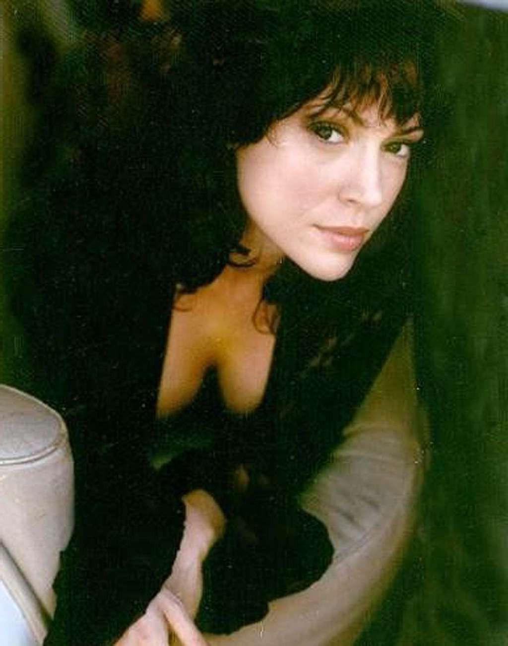 10P Alyssa Milano leggy in mini skirt and showing big cleavage and her tits