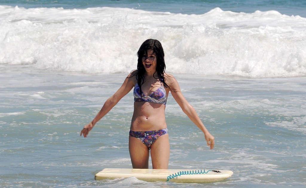 16P Selena Gomez exposing sexy body and hot ass in bikini on beach