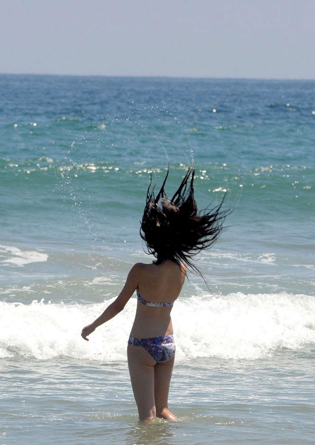 16P Selena Gomez exposing sexy body and hot ass in bikini on beach