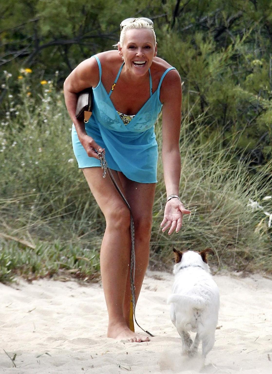 16P Brigitte Nielsen leggy wearing tiny summer dress on a holiday in Saint Tropez