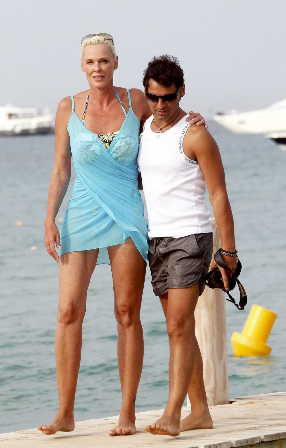 16P Brigitte Nielsen leggy wearing tiny summer dress on a holiday in Saint Tropez