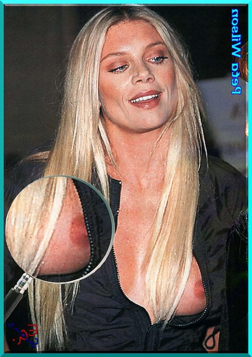 16P Peta Wilson exposing her nice big tits and posing nude in toilet