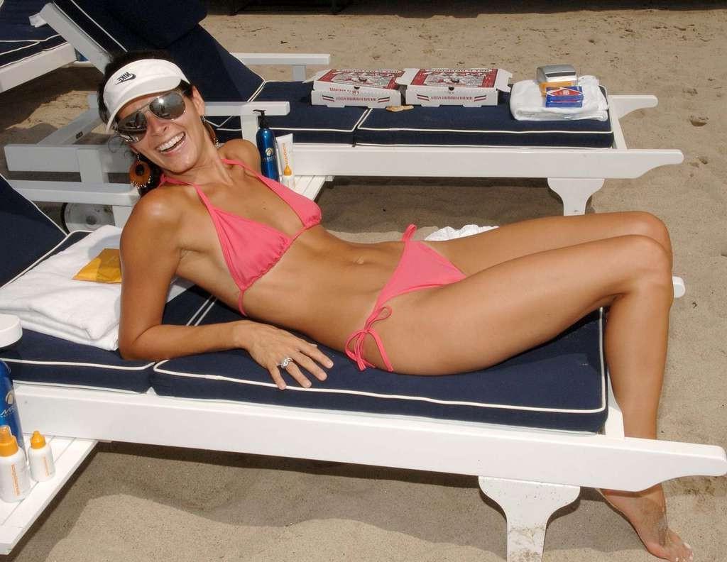10P Angie Harmon exposing her nice ass in thong and her big tits in see thru top to 