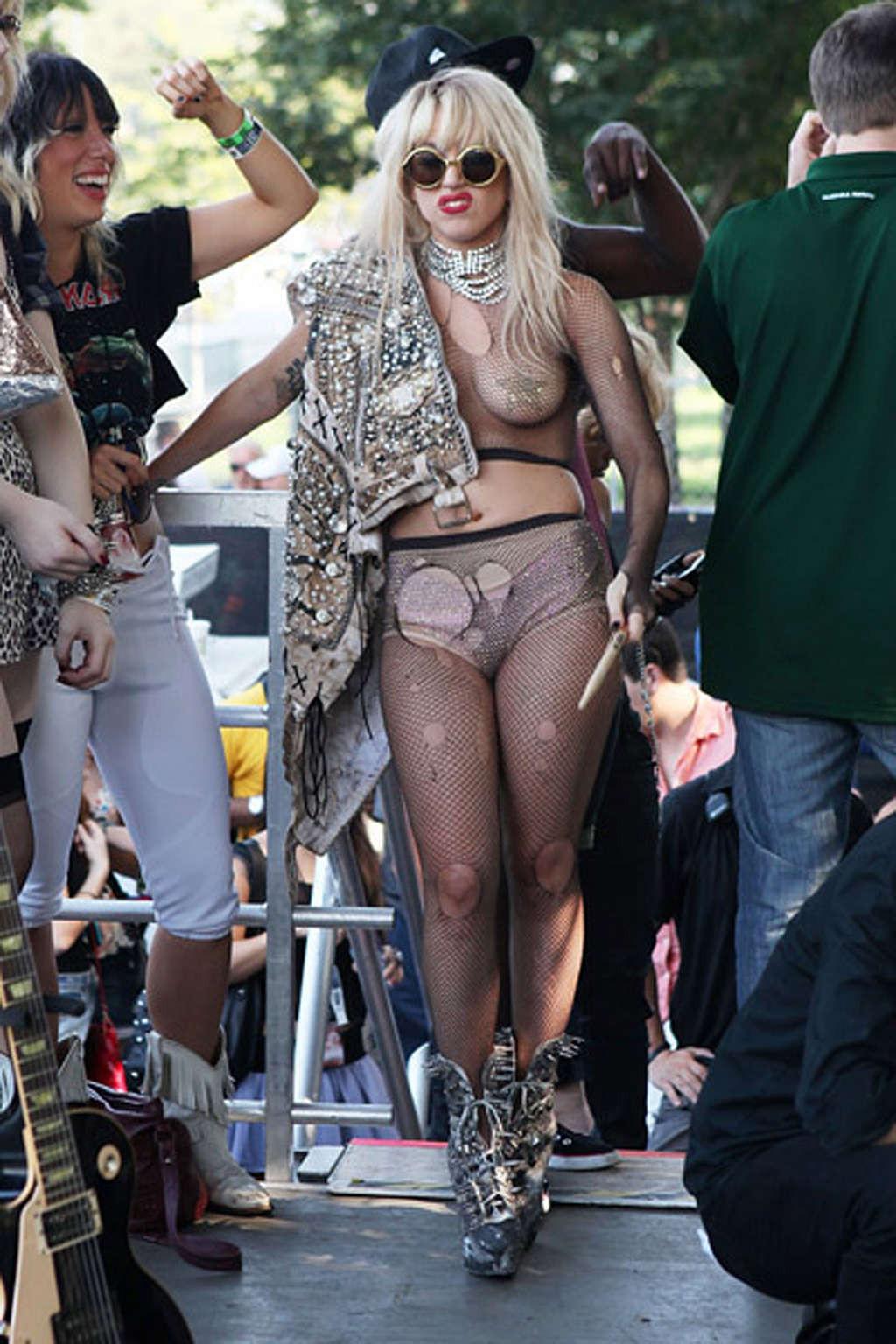 10P Lady Gaga with tape covering her nipples in see thru top on stage