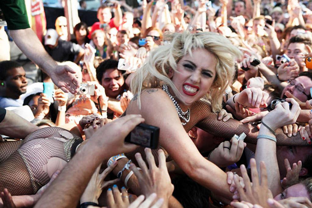 10P Lady Gaga with tape covering her nipples in see thru top on stage