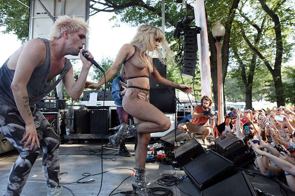 10P Lady Gaga with tape covering her nipples in see thru top on stage