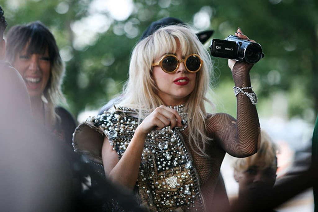 10P Lady Gaga with tape covering her nipples in see thru top on stage