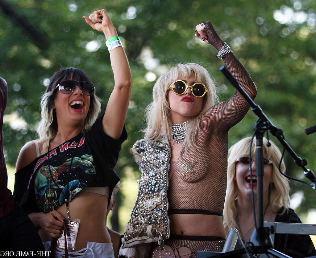 10P Lady Gaga with tape covering her nipples in see thru top on stage