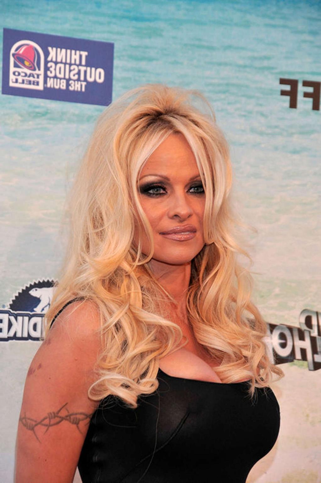 16P Pamela Anderson exposing her sexy body and hot nipples in see thru dress