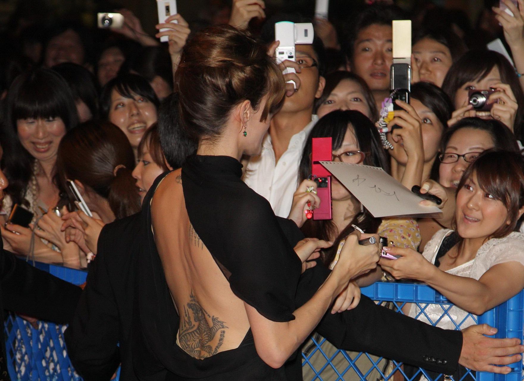 16P Angelina Jolie leggy in black high slit dress at the 'Salt' premiere in Tokyo