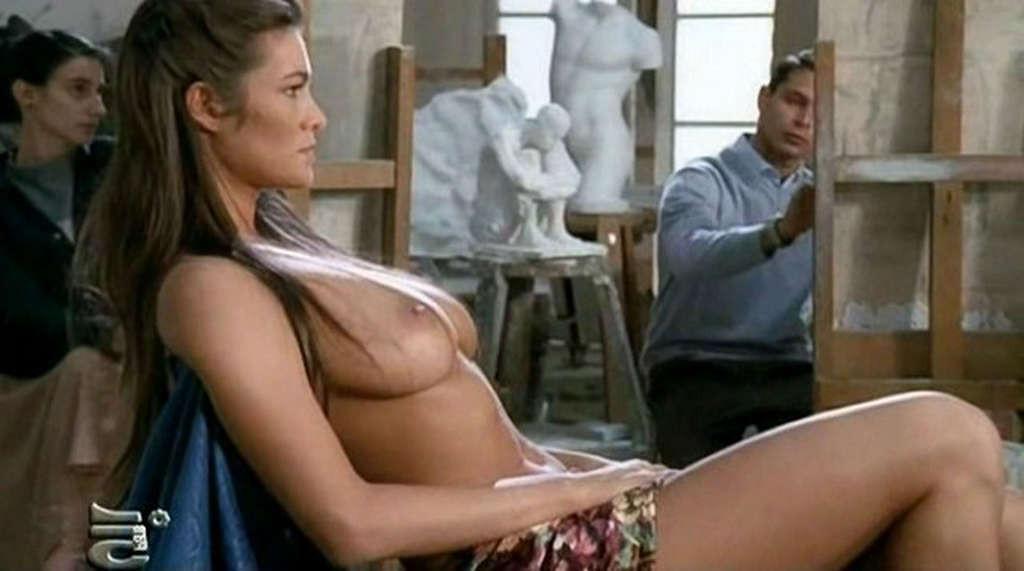 10P Manuela Arcuri exposing her huge boobs in nude movie scenes and posing sexy in b
