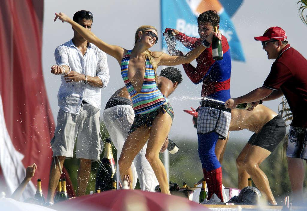 10P Paris Hilton another topless sunbathing on yach and partying in bikini on beach 