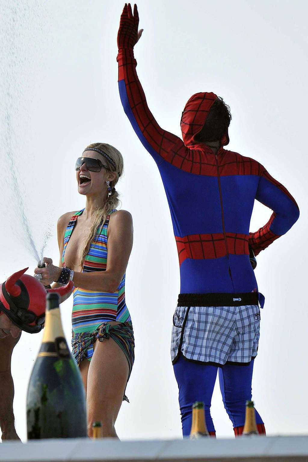 10P Paris Hilton another topless sunbathing on yach and partying in bikini on beach 