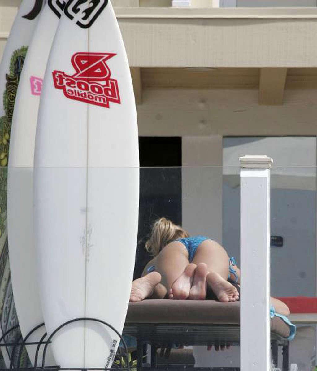 16P Kristin Cavallari exposing her sexy body and hot ass in bikini on pool
