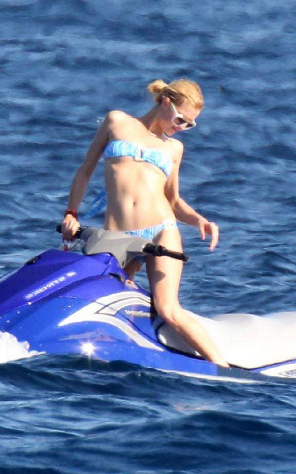 10P Paris Hilton exposing her nice tits while sunbathing topless on yacht paparazzi 