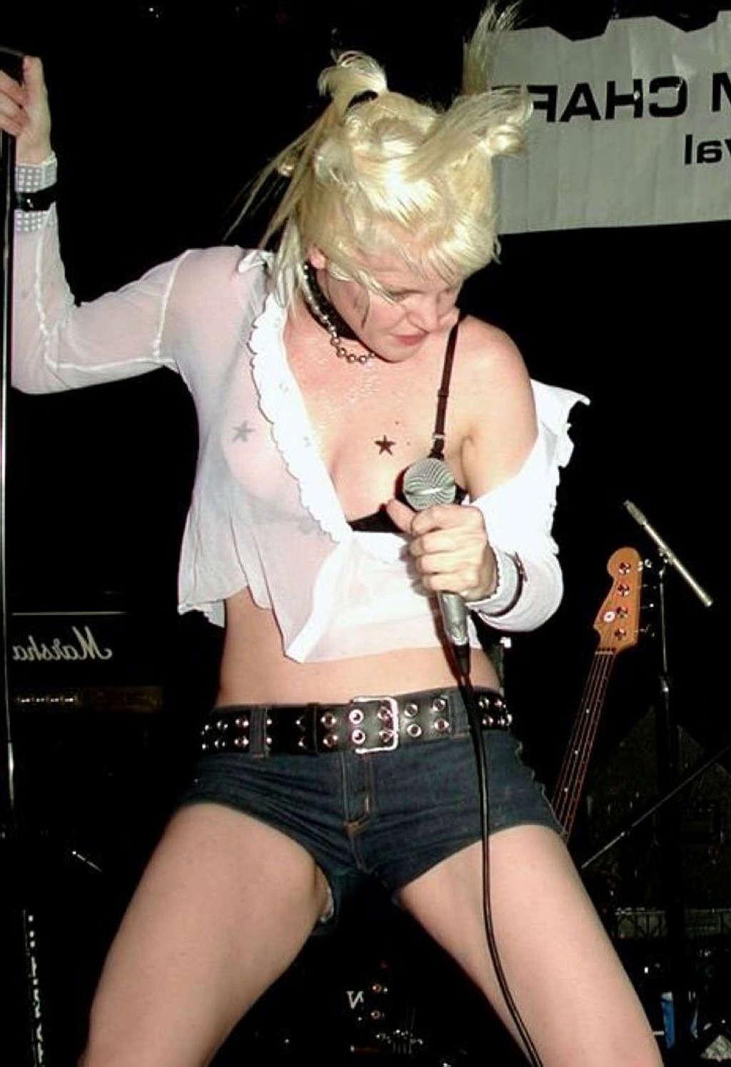 10P Pauley Perrette tits slip while singing and undressing her top