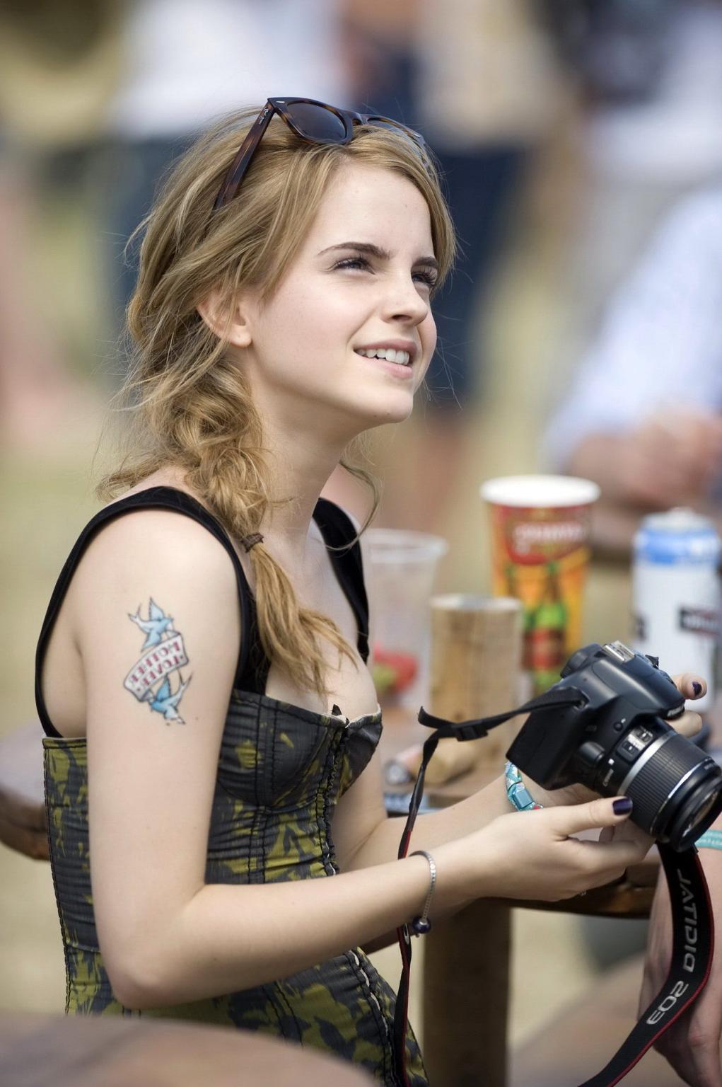 16P Emma Watson leggy  cleavy wearing low cut top, shorts  bots at Glastonbury Music